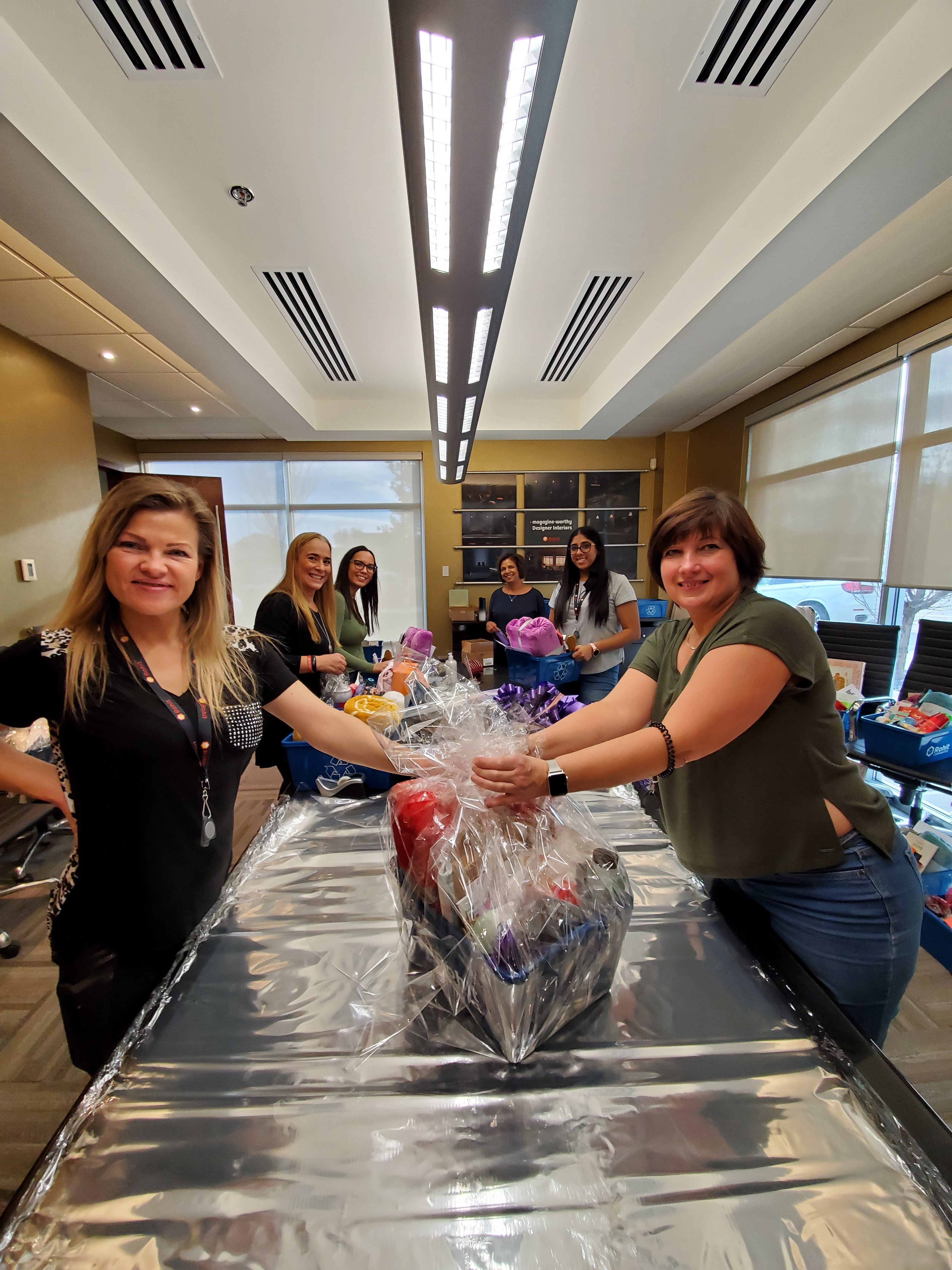 Volunteers gathered at a past Baskets of Hope event